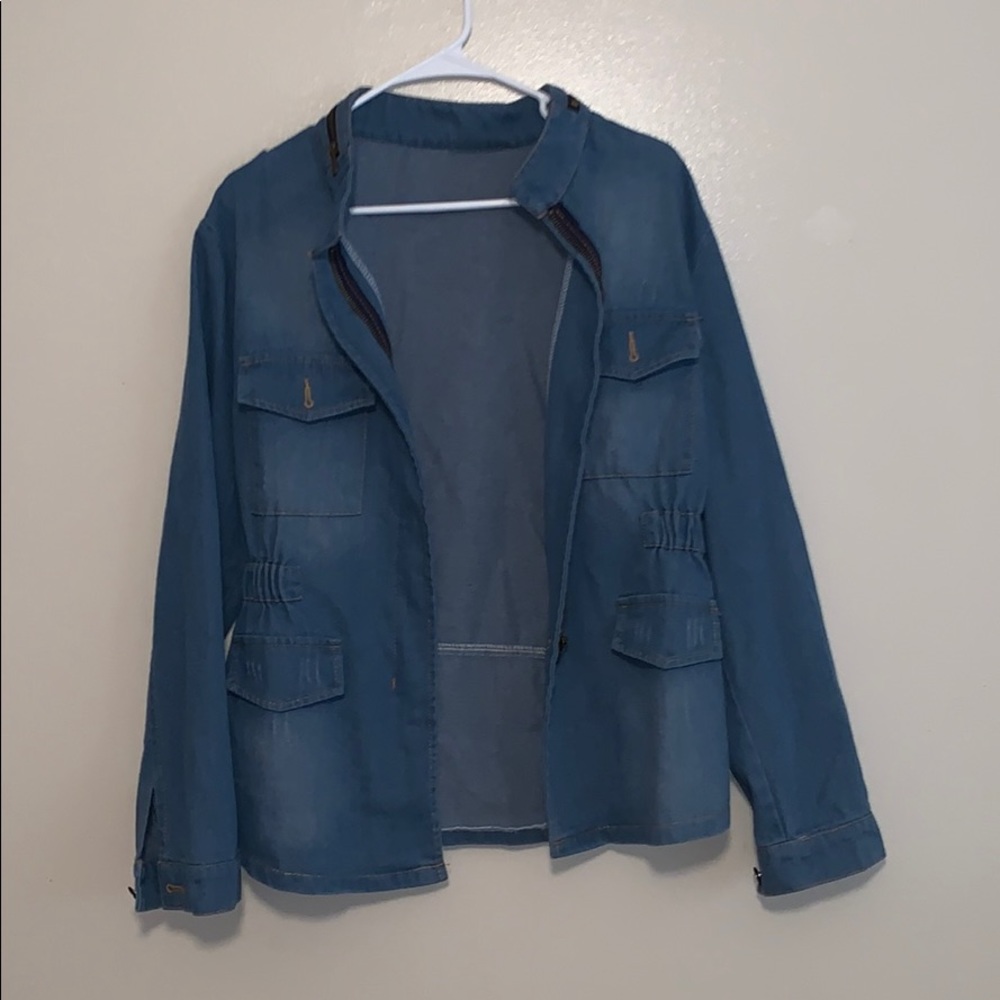 Distressed denim jacket with zip details